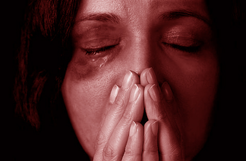 Dramatic portrait of female victim of domestic violence